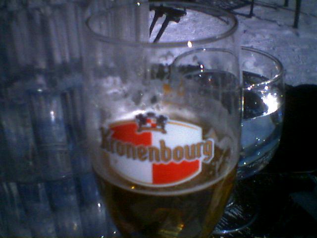 Kronenbourg beer glass half full